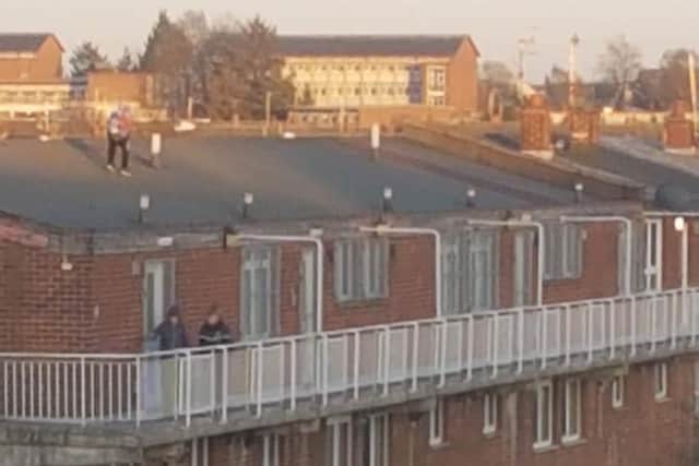Youngsters on the roof of flats in Lurgan's Russell Drive