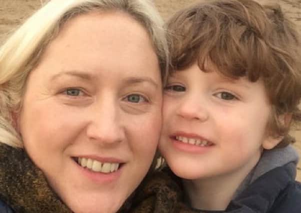 Tara McIntyre with her son Matthew, who she said has been on the autism diagnosis waiting list for more than a year
