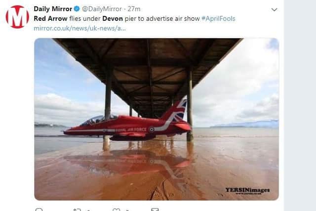 Red Arrows fly under Devon pier to advertise new show.