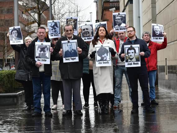 Families of the people who were killed during a disputed series of shootings in the Ballymurphy area of Belfast in August 1971 outside Belfast Coroner's Court, during a new inquest into their loved ones deaths.