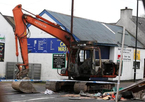 A digger burned out after an ATM theft