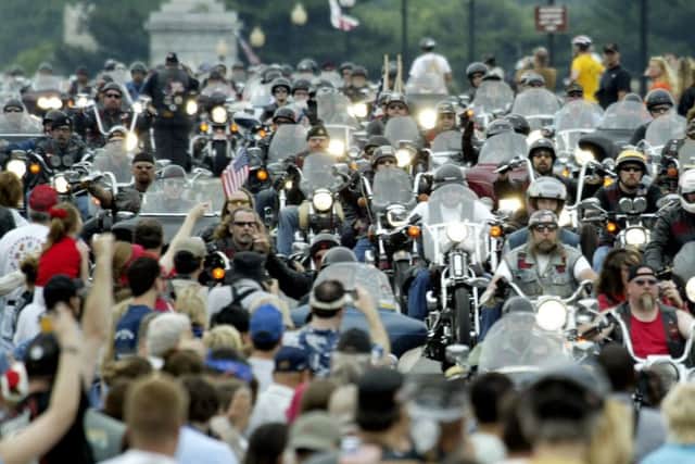 WASHINGTON - MAY 30:  Motorcyclists participating in the 17th annual Memorial Day Rolling Thunder Rally make their way across the Memorial Bridge May 30, 2004 into Washington, DC. Over 250, 000 bikers rode from the Pentagon in Virginia to the Vietnam Memorial on the National Mall to commemorate the sacrifices made by Vietnam Veterans and POW/MIAs.  (Photo by Brendan Smialowski/Getty Images)