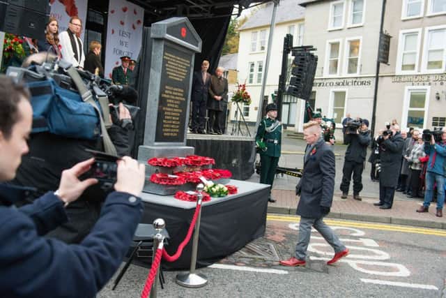 Family members of victims of the Enniskillen bomb lay wreaths at the memorial to honour the victims of the Enniskillen bomb which was unveiled at Belmore Street, Enniskillen on the 30th Anniversary of the bombing. The memorial was put into storage immediately afterwards. Picture: Ronan McGrade/Pacemaker