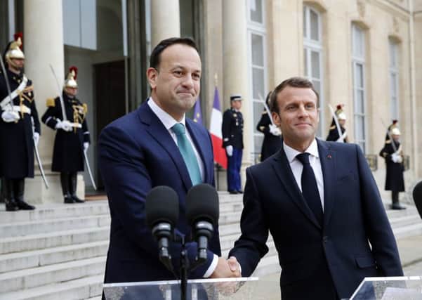 French President Emmanuel Macron, right, shakes hands with Irish Prime Minister Leo Varadkar in Paris yesterday