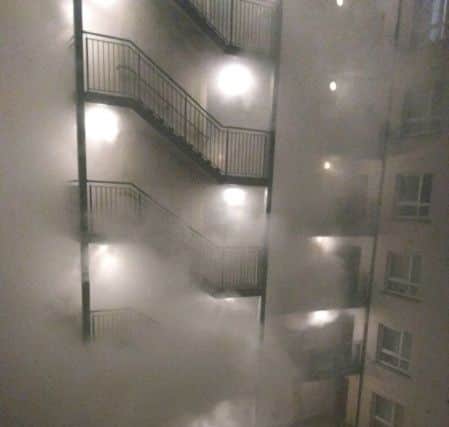 Smoke filled the square in the middle of the apartment building at Great Victoria Street.