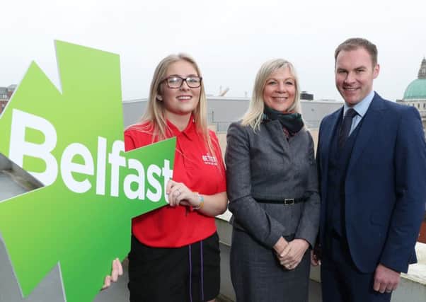 Belfast City Council CEO Suzanne Wylie, centre, with GLL NI regional director Gareth Kirk and Devon Small, GLL