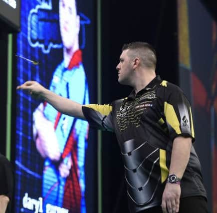 4/4/19: Daryl Gurney in action against Rob Cross during the Unibet Premier League Darts at the SSE Arena, Belfast. Picture: Michael Cooper