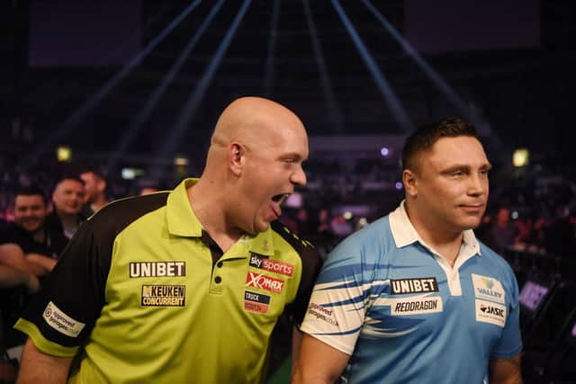 4/4/19: Michael van Gerwen and Gerwyn Price during the Unibet Premier League Darts at the SSE Arena, Belfast. Picture: Michael Cooper