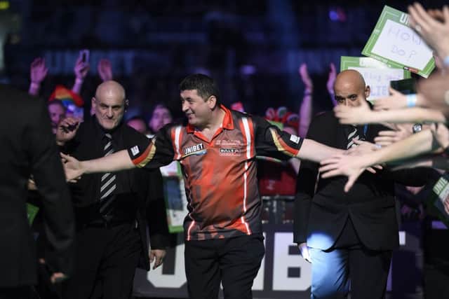 4/4/19: Mensur Suljovic in action against James Wade during the Unibet Premier League Darts at the SSE Arena, Belfast. Picture: Michael Cooper