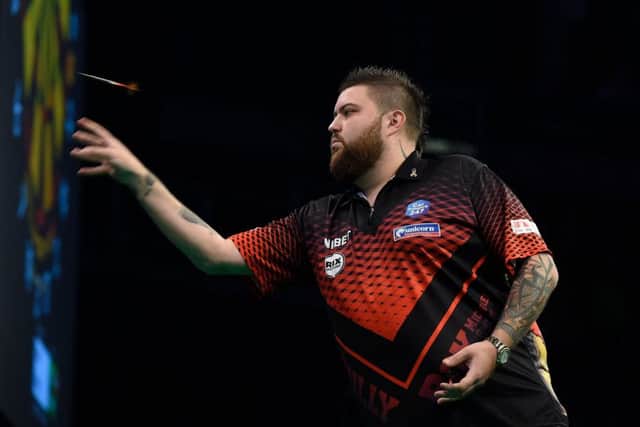 4/4/19: Michael Smith in action against Peter Wright during the Unibet Premier League Darts at the SSE Arena, Belfast. Picture: Michael Cooper