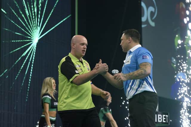 4/4/19: Michael van Gerwen and Gerwyn Price during the Unibet Premier League Darts at the SSE Arena, Belfast. Picture: Michael Cooper