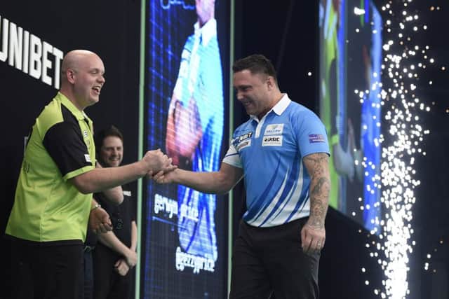 4/4/19: Michael van Gerwen and Gerwyn Price during the Unibet Premier League Darts at the SSE Arena, Belfast. Picture: Michael Cooper