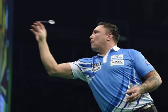 4/4/19: Gerwyn Price in action against Michael van Gerwen during the Unibet Premier League Darts at the SSE Arena, Belfast. Picture: Michael Cooper