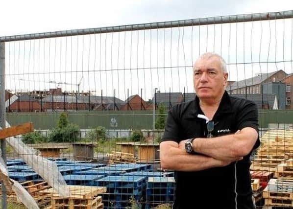 Ex-soldier turned author Ken Wharton stands at the former site of Old North Howard Street army barracks in Belfast.