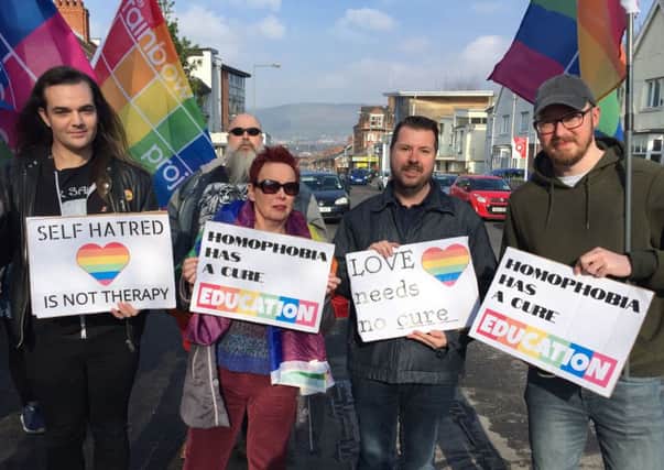 Campaigners for LGBT rights holding a protest outside Windsor Baptist Church in Belfast