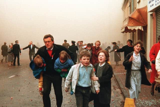 Members of the public flee the Enniskillen Poppy Day massacre in terror in 1987. The IRA blew up building at Remembrance Day service, killing 11 and injured many more. Photo Pacemaker.