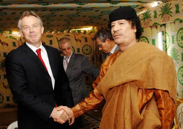 Then prime minister Tony Blair meeting Libyan leader Colonel Muammar Gaddafi at his desert base outside Sirte south of Tripoli in 2007. Gaddafi supplied several tonnes of Semtex explosive to the IRA
