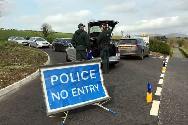 Police  at a security alert  outside Castlewellan following the discovery of a suspicious object
