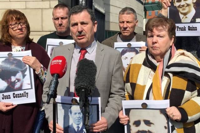 John Teggart (centre), whose father Danny was shot dead in Ballymurphy, speaks to media outside Belfast Coroner's Court, alongside other bereaved relatives. (Photo: David Young/P.A. Wire)
