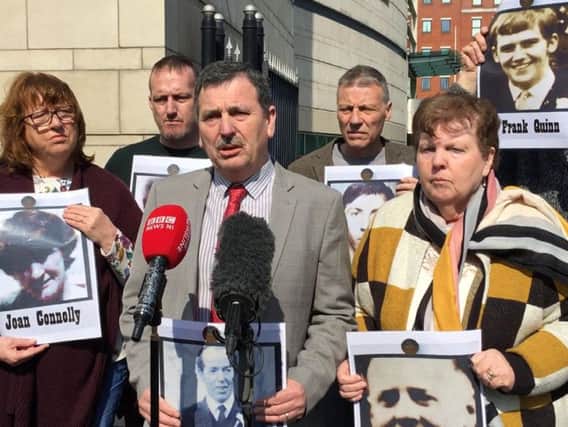 John Teggart (centre), whose father Danny was shot dead in Ballymurphy, speaks to media outside Belfast Coroner's Court, alongside other bereaved relatives. (Photo: David Young/P.A. Wire)