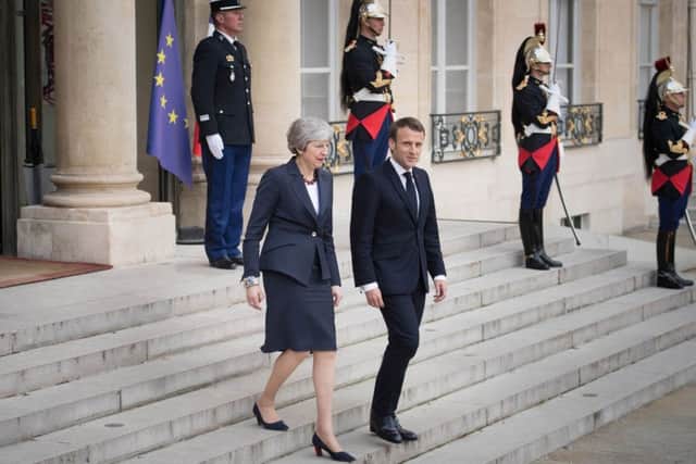 Prime Minister Theresa May and French President Emmanuel Macron leaving after Brexit talks at the Elysee Palace in Paris. Earlier, the PM had held talks in Germany with Angela Merkel. Pic: Stefan Rousseau/PA Wire