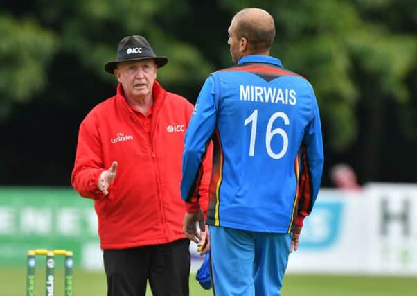 Umpire Alan Neill has words with Afghanistan's Mirwais Ashram. Pic by PressEye Ltd.