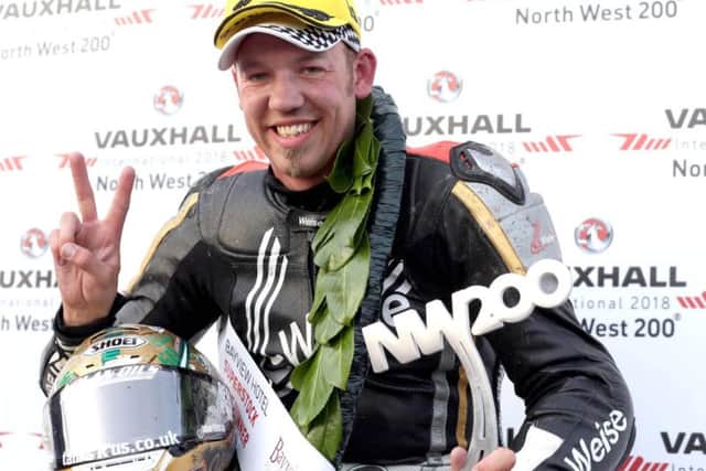 Smiths BMW rider Peter Hickman celebrates his victory in the Superstock class at the North West 200 last year.