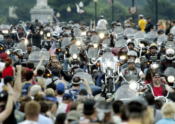 Motorcyclists participating in the 17th annual Memorial Day Rolling Thunder Rally make their way across the Memorial Bridge on May 30, 2004 into Washington, DC.  The London event today was named after the US rally. (Photo by Brendan Smialowski/Getty Images)
