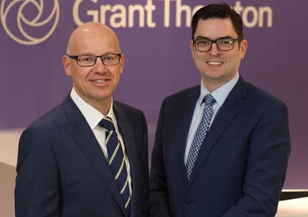 Newly appointed economist at Grant Thornton  Andrew Webb, right, with managing partner in Belfast Richard Gillan