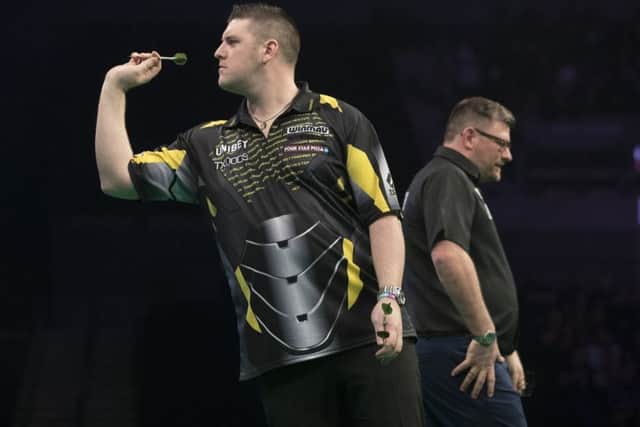 Daryl Gurney in action against James Wade.