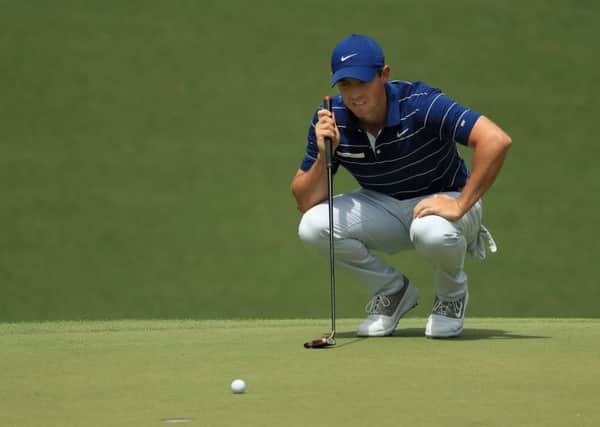 Rory McIlroy  lines up a putt on the 10th green during the first round of the Masters