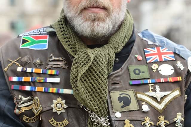 One of the motorcyclists taking part in the Rolling Thunder ride protest in London wearing a jacket adorned in medals and badges. The ride is to support of Soldier F who is facing prosecution over Bloody Sunday. PRESS ASSOCIATION Photo. Picture date: Friday April 12, 2019. Soldier F is to be charged with murdering two people after troops opened fire on civil rights demonstrators in Londonderry in 1972. See PA story ULSTER Sunday. Photo credit should read: Kirsty O'Connor/PA Wire