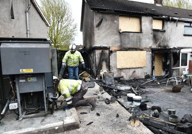 One house was destroyed and another badly damaged in the fire, which also damaged an electricity substation