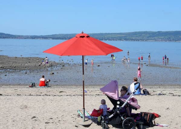People enjoy sunny weather at Seapark, Holywood in Co Down in July 2017. The Sunday Times considers Holywood the best place to live in Northern Ireland and one of the best places in the UK