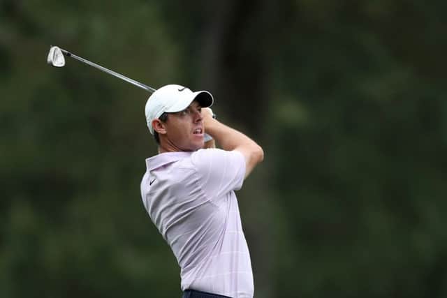 Rory McIlroy of Northern Ireland plays a shot on the 14th hole during the final round of the Masters at Augusta National Golf Club