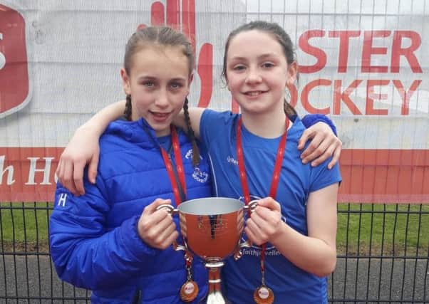 Katie Herron and Rebekah Lennon with the NI club trophy they won with Portadown