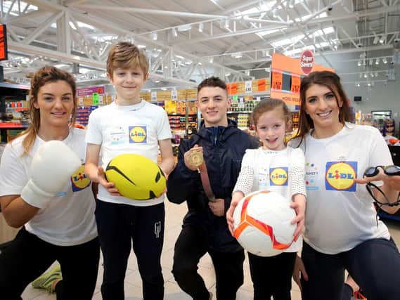MMA gold medallist and Jiu Jitsu champion Leah McCourt, Leo Cullen, European gold gymnast Rhys McClenaghan, Ellie McGuigan and four-time Paralympic gold swimmer Bethany Firth pictured at the Lidl Connswater store to launch the programme