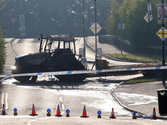 A burnt out tractor at the scene of another ATM robbery in Crumlin, Co Antrim