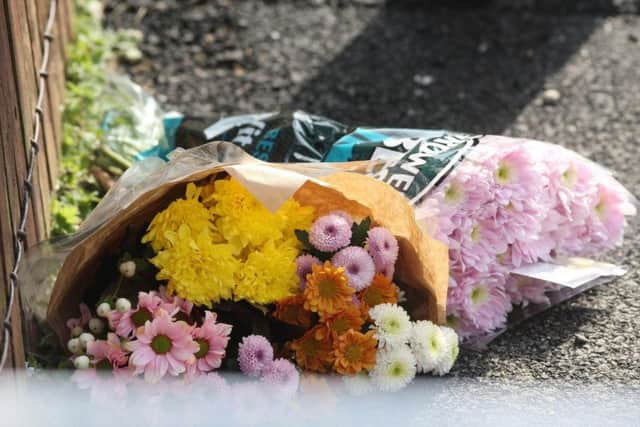 Flowers left at the scene of the murder