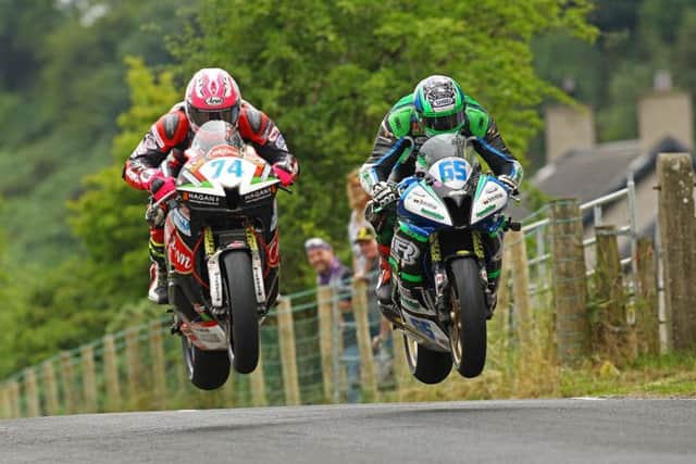 Davey Todd (left) and Michael Sweeney in close company during the Friday Supersport race at Armoy in 2018. Saturday's main race programme was wiped out by heavy rain.