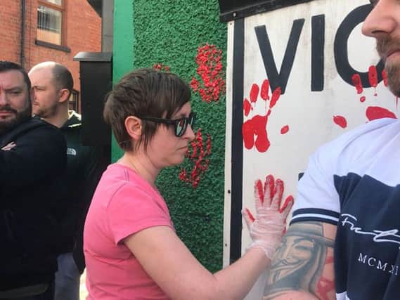 Friends of murdered journalist Lyra McKee defaced the walls of a dissident republican office with red paint. Photo credit: Cate McCurry/ PA Wire