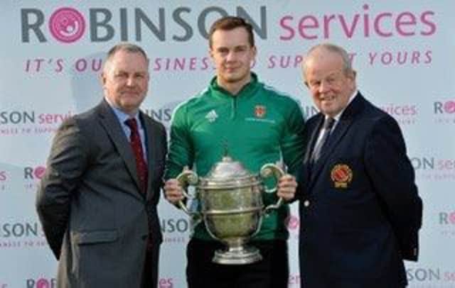 Captain Adam Berry  represented Lisburn Cricket Club at the pre-season photo session for the eight Robinson Services Premier League sides. He's pictured with David Robinson, managing director of Robinson Services, and Richard Johnson, president of the Northern Cricket Union.