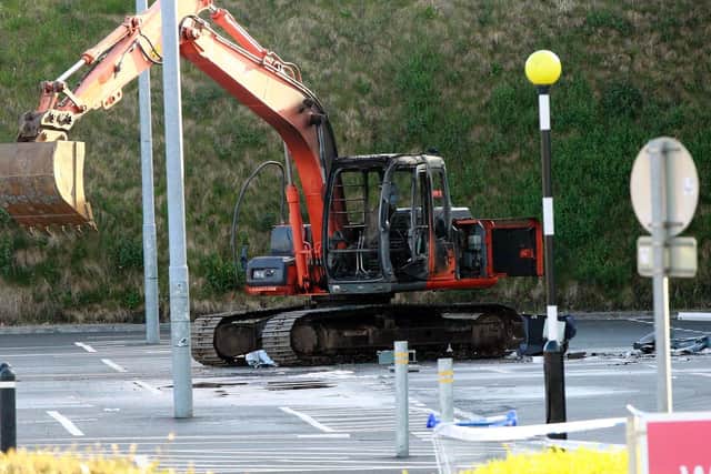 The digger used in the latest ATM theft in Ballymena was set on fire in the car park of the supermarket. Pic: Pacemaker