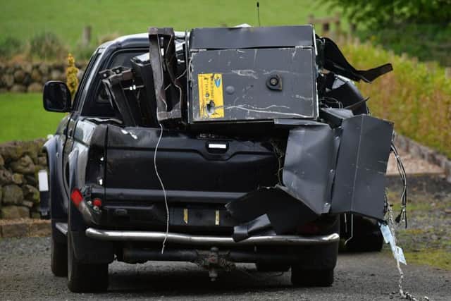 The pick-up vehicle and stolen cash machines were abandoned at Woodside Road. Pic: Colm Lenaghan/Pacemaker