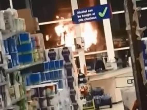 The tractor and digger were set on fire outside a supermarket. (Photo/Video: Laura O'Boyle)