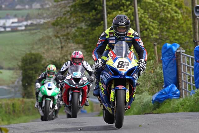 Derek Sheils (Burrows Engineering/RK Racing Suzuki) leads Adam McLean (McAdoo Kawasaki) and Derek McGee (Lady B Kawasaki) in the Open A Race at the Cookstown 100. Picture: Pacemaker Press.