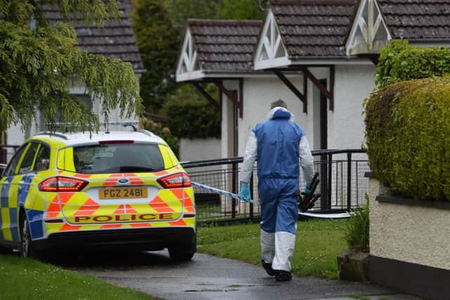 Police and forensic specialists remained at the scene of a weekend fatal stabbing incident at Cairn Walk in Crumlin on Monday gathering evidence
