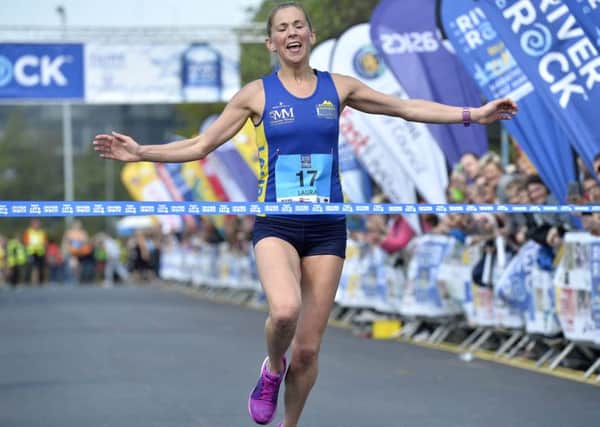 Winner of the ladies race in the 2017 Belfast City Marathon, Laura Graham from Kilkeel crosses the finish line at Ormeau Park (S Hamilton-Press Eye).