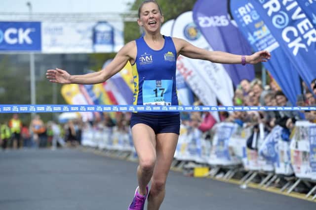 Winner of the ladies' race in the 

2017 Deep River Rock Belfast City Marathon, Laura Graham from Kilkeel, pictured at the finish line at Ormeau park. Photo: Stephen Hamilton / Press Eye