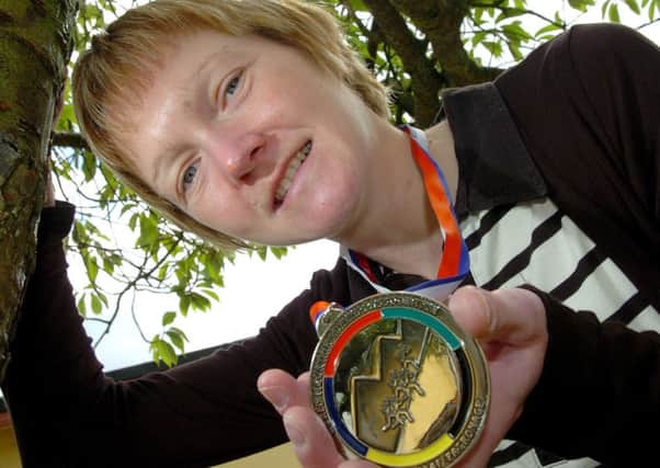 Karen Alexander proudly displays her silver medal after competing at the World Mountain Marathon Championships held in Podrdo in Slovenia
